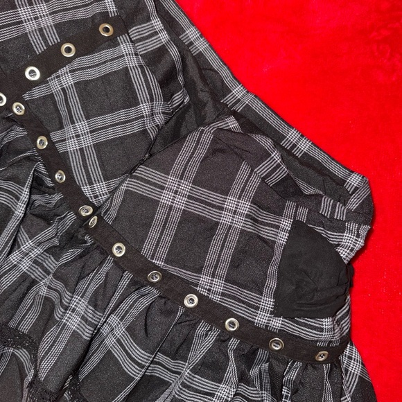 Black and grey plaid mini skirt with lace trim, studded lining, and back bow - Picture 3 of 3